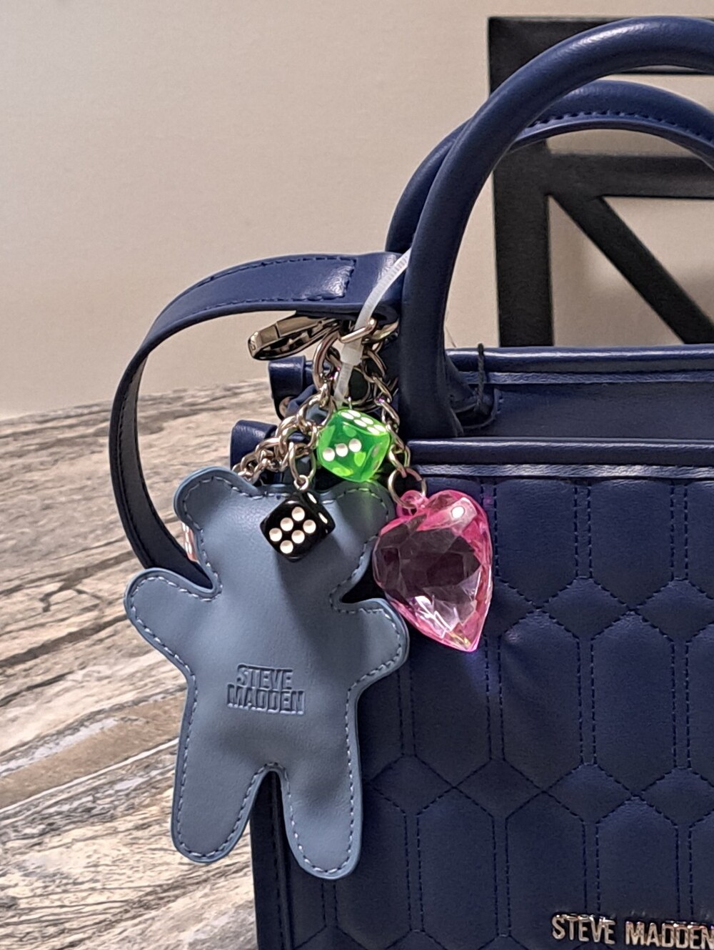 Steve Madden Navy Binko Quilted Satchel with Bag Charms & Cross.\nBody Strap - Picture 3 of 6